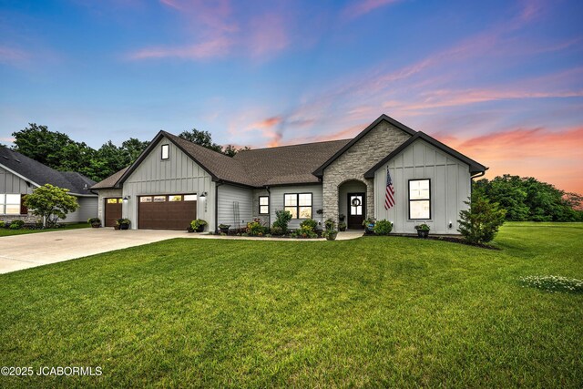 1308 Haxby Ct, Columbia, MO 65201 - modern farmhouse style home featuring board and batten siding, an attached garage, a lawn, concrete driveway, and a shingled roof