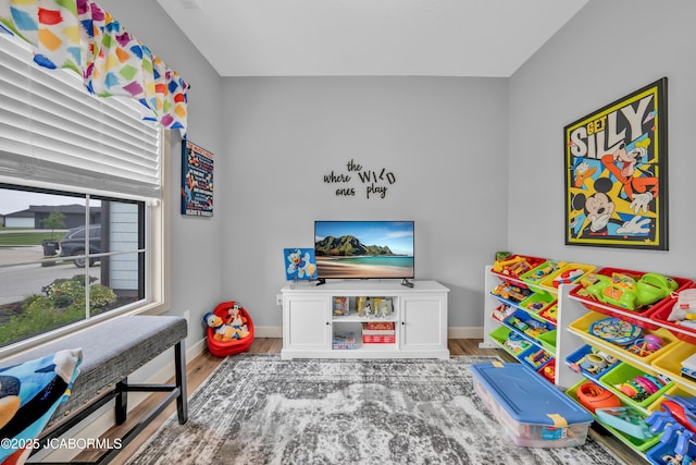 1308 Haxby Ct, Columbia, MO 65201 - playroom featuring wood finished floors and baseboards