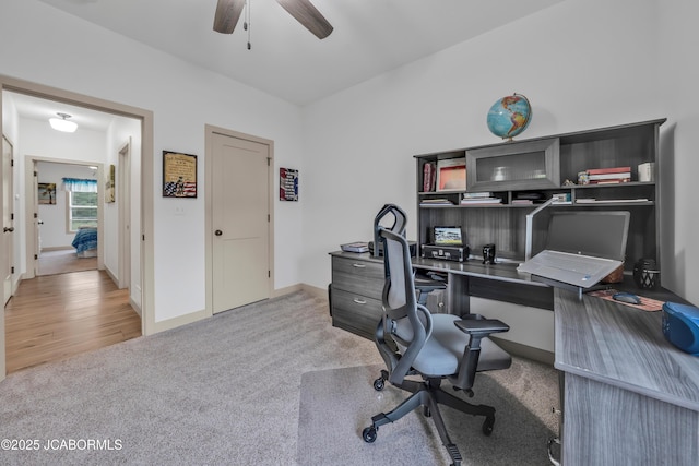 1308 Haxby Ct, Columbia, MO 65201 - home office with light carpet, a ceiling fan, and baseboards