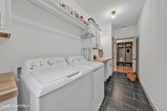 1308 Haxby Ct, Columbia, MO 65201 - laundry room featuring washer and clothes dryer and cabinet space