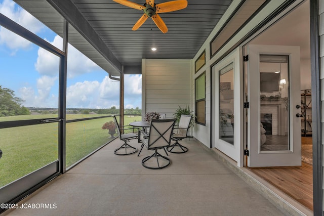 1308 Haxby Ct, Columbia, MO 65201 - sunroom / solarium with ceiling fan and outdoor dining space