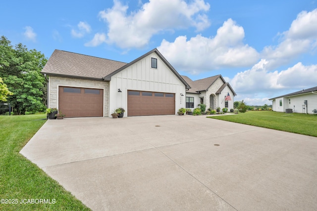 1308 Haxby Ct, Columbia, MO 65201 - modern inspired farmhouse featuring board and batten siding, a garage, a front lawn, driveway, and central AC