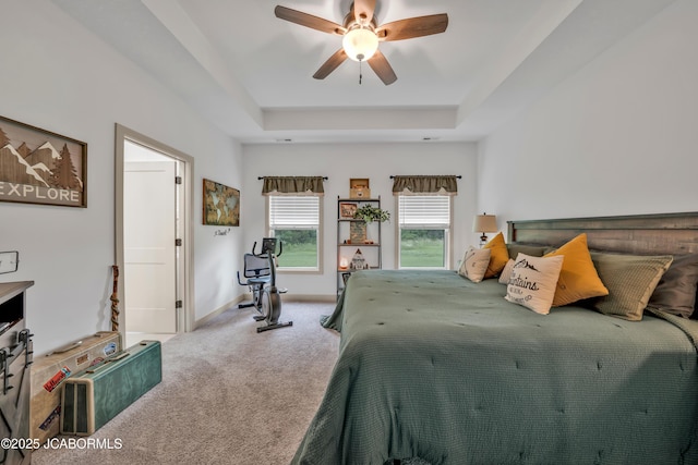 1308 Haxby Ct, Columbia, MO 65201 - carpeted bedroom featuring a tray ceiling, baseboards, and a ceiling fan
