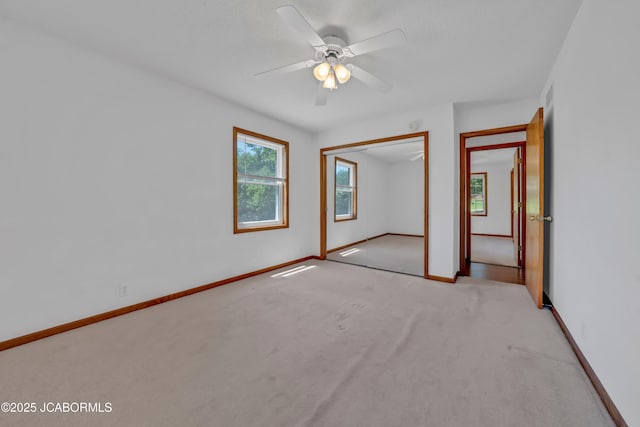 29311 State Highway Pp, California, MO 65018 - unfurnished bedroom featuring light carpet, baseboards, a closet, and a ceiling fan
