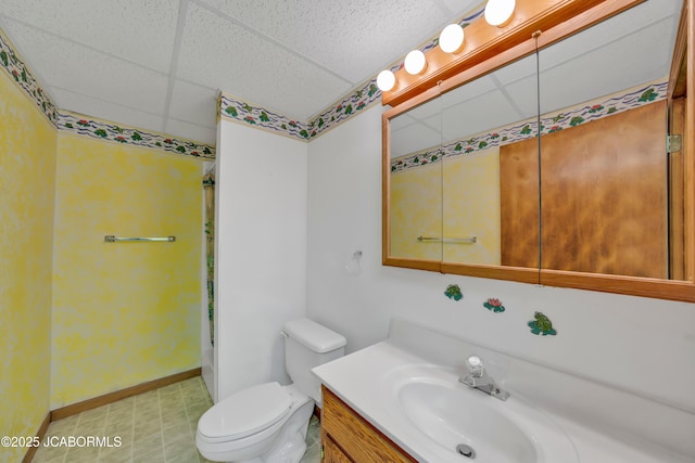 29311 State Highway Pp, California, MO 65018 - full bathroom featuring a drop ceiling, vanity, toilet, baseboards, and tile patterned floors