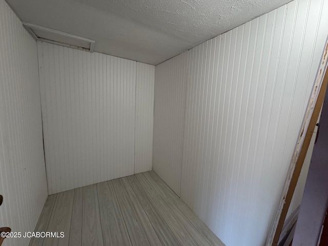 5566 Bonnie Spring Valley Dr, Stover, MO 65078 - spare room with a textured ceiling and wood finished floors
