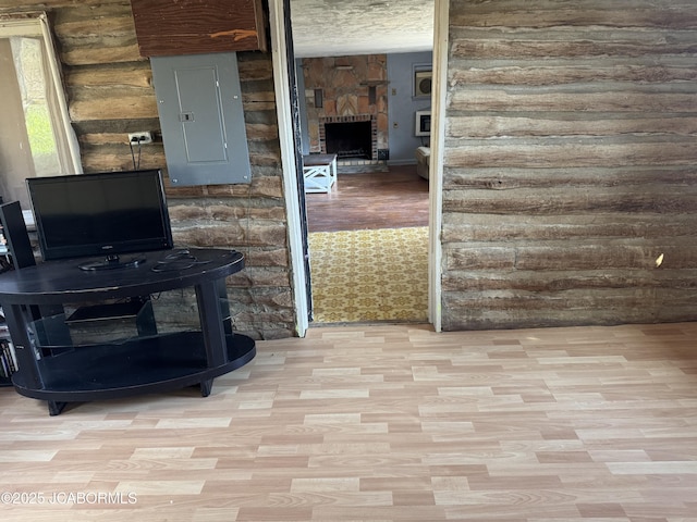 5566 Bonnie Spring Valley Dr, Stover, MO 65078 - interior details featuring a fireplace, wood finished floors, and electric panel