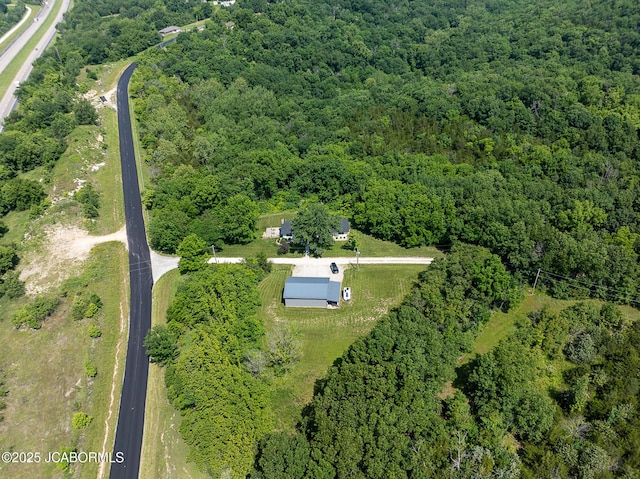 7165 E Hartman Rd, Hartsburg, MO 65039 - aerial view of property and surrounding area with a forest