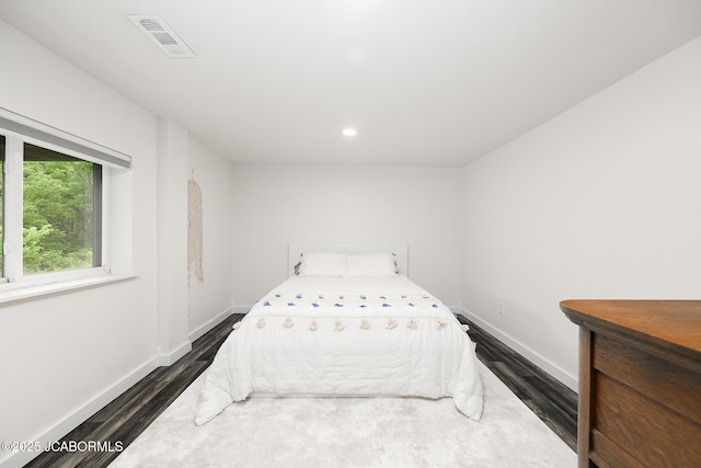 7165 E Hartman Rd, Hartsburg, MO 65039 - bedroom with dark wood finished floors and recessed lighting