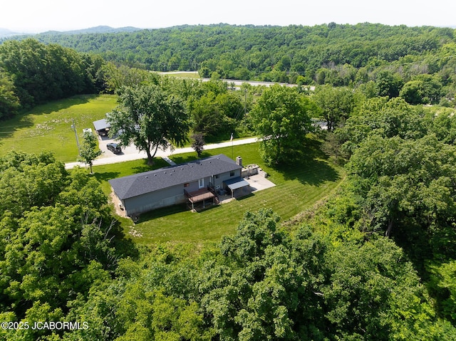 7165 E Hartman Rd, Hartsburg, MO 65039 - aerial view of property and surrounding area featuring a heavily wooded area