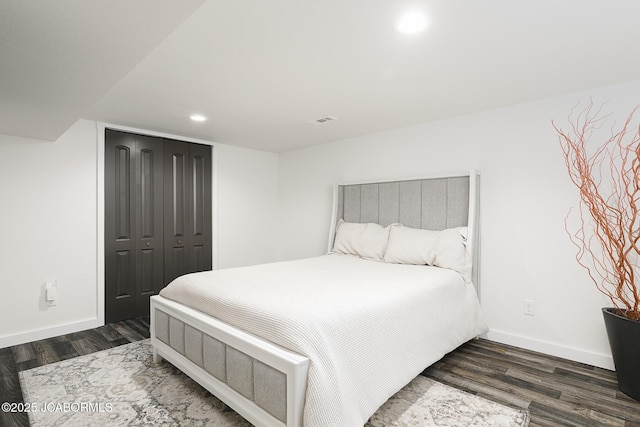 7165 E Hartman Rd, Hartsburg, MO 65039 - bedroom featuring dark wood-style floors, recessed lighting, and a closet