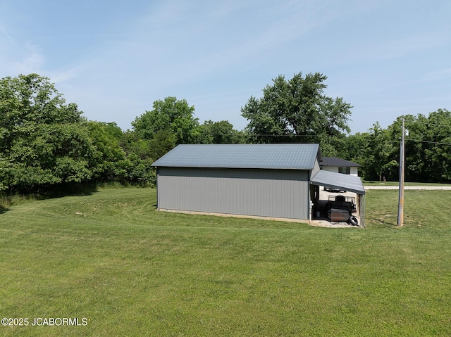 7165 E Hartman Rd, Hartsburg, MO 65039 - view of green lawn with an outbuilding and an outdoor structure