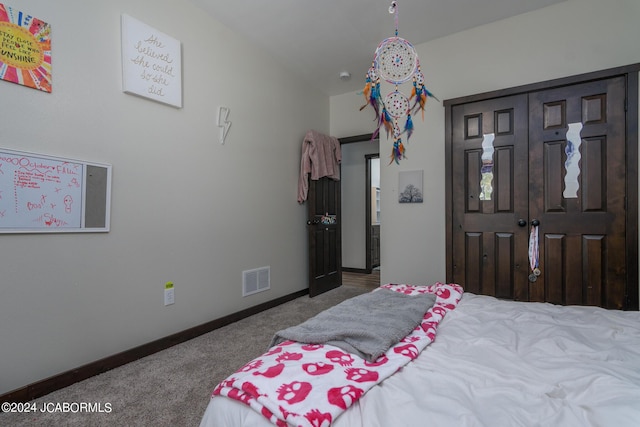 bedroom with carpet and a closet