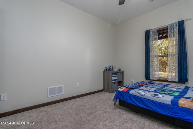 carpeted bedroom with ceiling fan