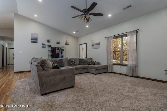living room featuring ceiling fan, hardwood / wood-style floors, and high vaulted ceiling