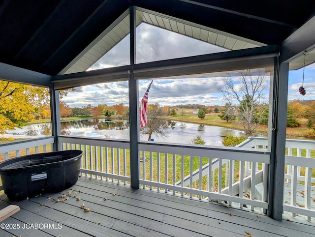 wooden deck with a water view