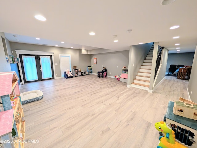 rec room with baseboards, french doors, recessed lighting, and light wood-style floors