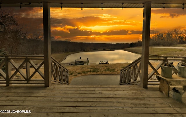 view of dock with a deck with water view