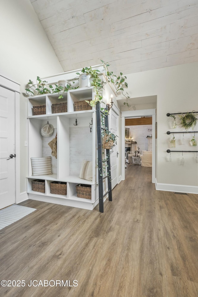 mudroom featuring hardwood / wood-style floors, lofted ceiling, and wooden ceiling