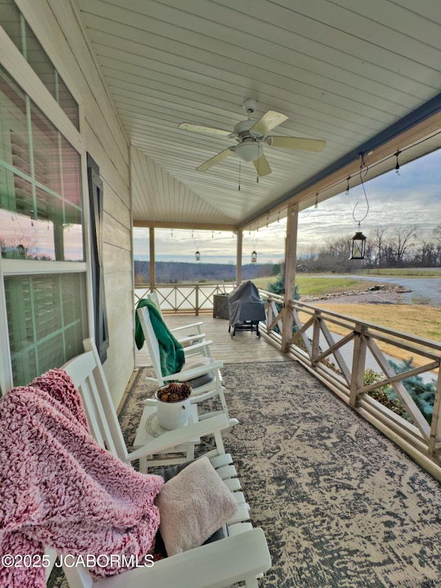 view of patio featuring ceiling fan