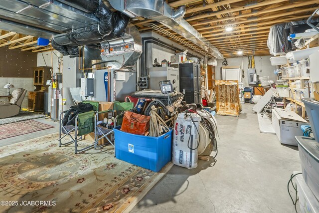 basement featuring gas water heater and electric panel