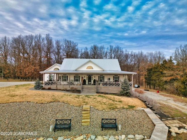 farmhouse inspired home with a porch