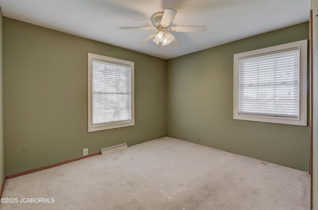 302 Park Rd, Fayette, MO 65248 - carpeted spare room featuring visible vents and ceiling fan