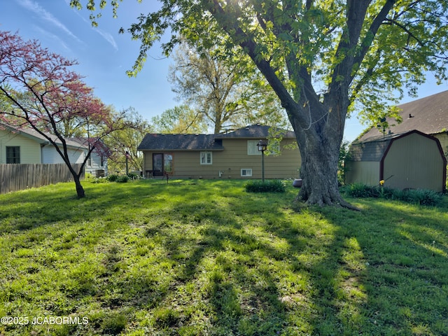 302 Park Rd, Fayette, MO 65248 - view of yard featuring a storage shed, fence, and an outdoor structure