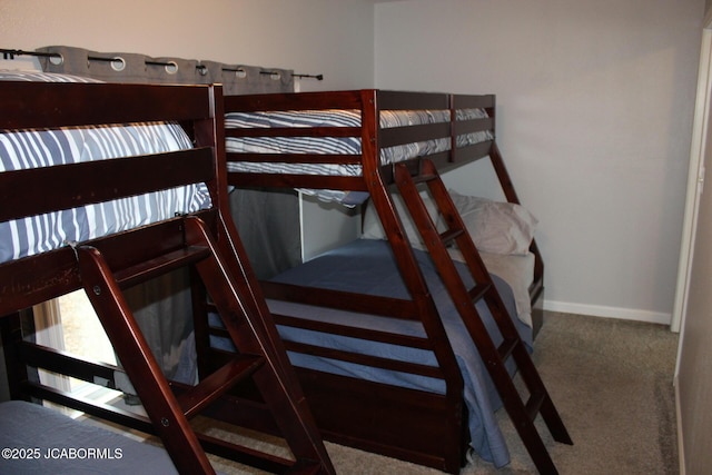 carpeted bedroom with baseboards