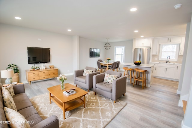 living room featuring light wood-style floors and recessed lighting