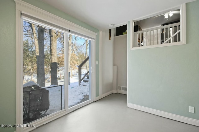 doorway with concrete floors