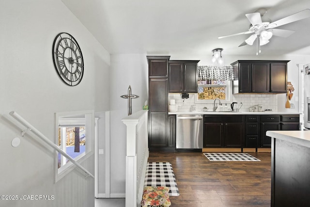 kitchen with ceiling fan, decorative backsplash, dark hardwood / wood-style floors, sink, and stainless steel dishwasher