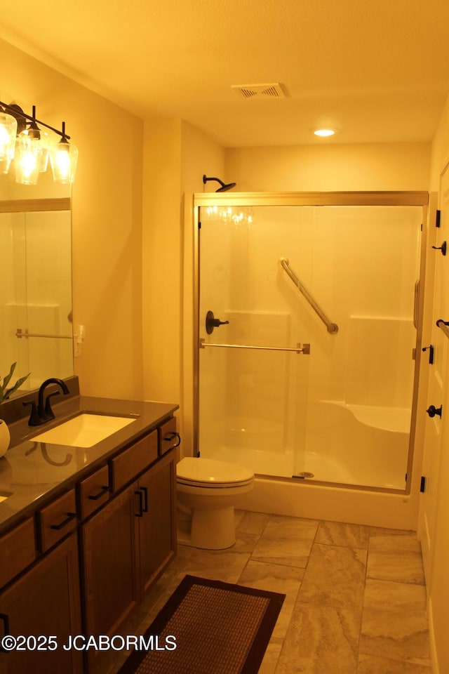 full bath featuring visible vents, a shower stall, toilet, and vanity