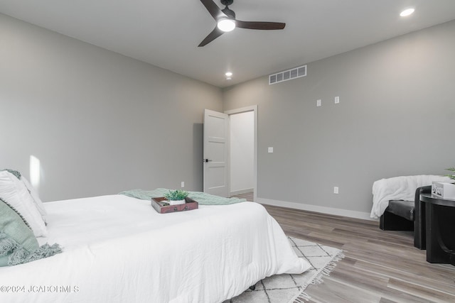 bedroom featuring ceiling fan and light wood-type flooring