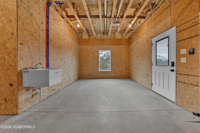 interior space featuring concrete flooring and sink