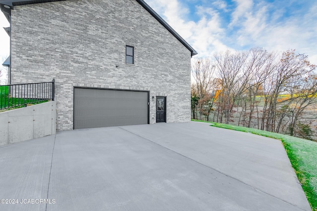 view of side of home with a garage