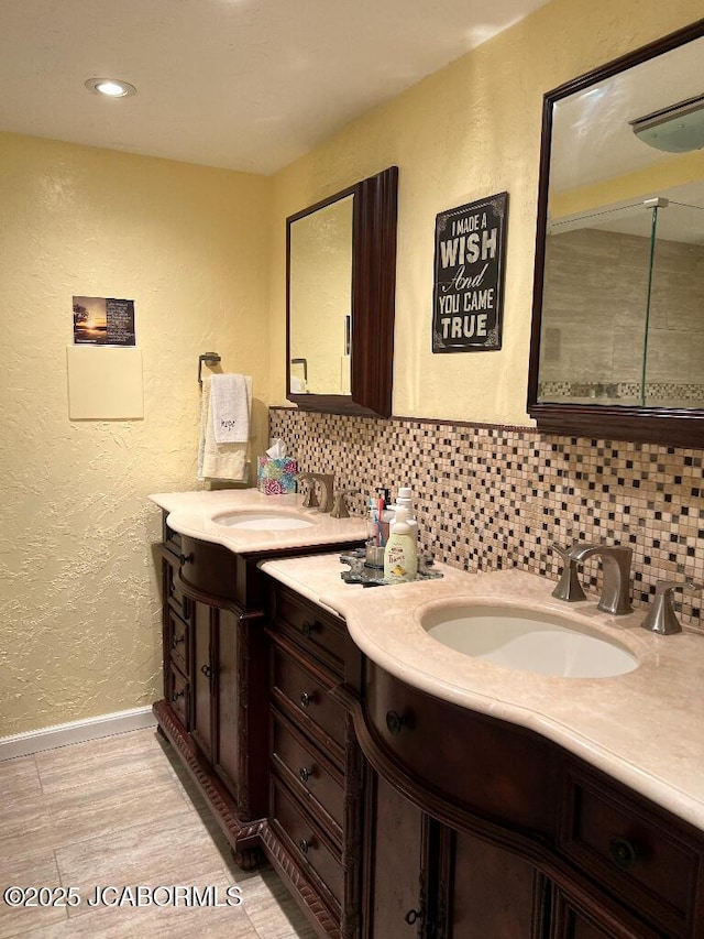 200 Sondra Ave, Columbia, MO 65202 - full bath with vanity, baseboards, tasteful backsplash, and a textured wall