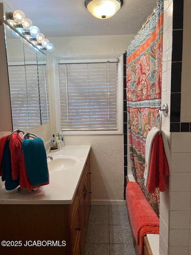 200 Sondra Ave, Columbia, MO 65202 - full bathroom with baseboards, shower / tub combo with curtain, vanity, and granite finish floor