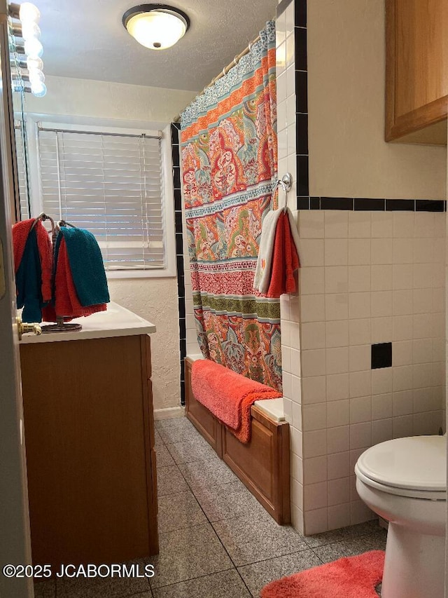 200 Sondra Ave, Columbia, MO 65202 - bathroom featuring tile walls, toilet, shower / tub combo, and vanity