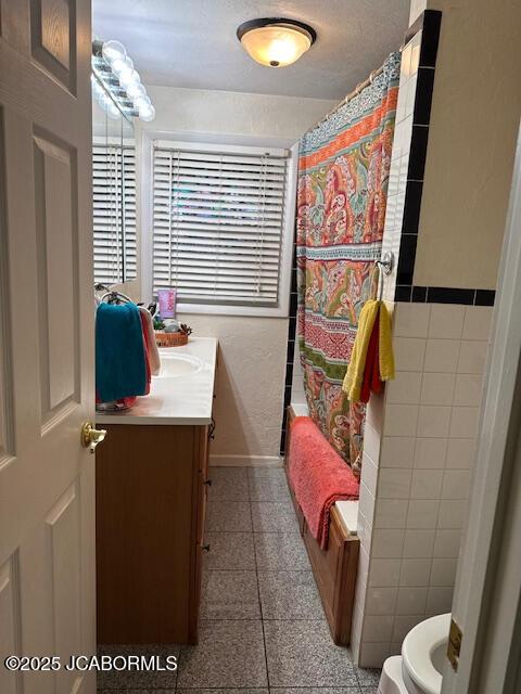 200 Sondra Ave, Columbia, MO 65202 - bathroom featuring toilet, shower / bath combo, granite finish floor, baseboards, and vanity