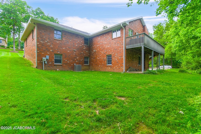 1101 E Maplewood Ct, Jefferson City, MO 65109 - rear view of house featuring a yard, central AC unit, and brick siding