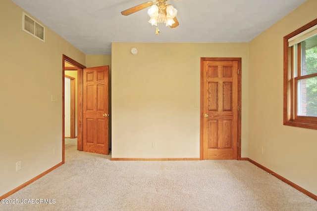 1101 E Maplewood Ct, Jefferson City, MO 65109 - carpeted empty room with baseboards and a ceiling fan