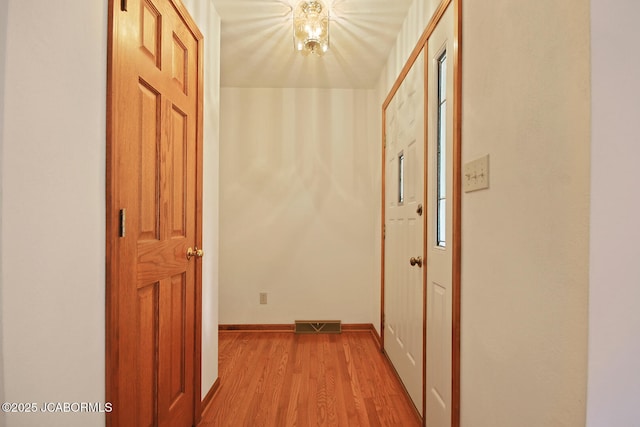 1101 E Maplewood Ct, Jefferson City, MO 65109 - hall with light wood-style floors and baseboards