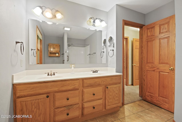 1101 E Maplewood Ct, Jefferson City, MO 65109 - bathroom with double vanity, tile patterned flooring, and a shower