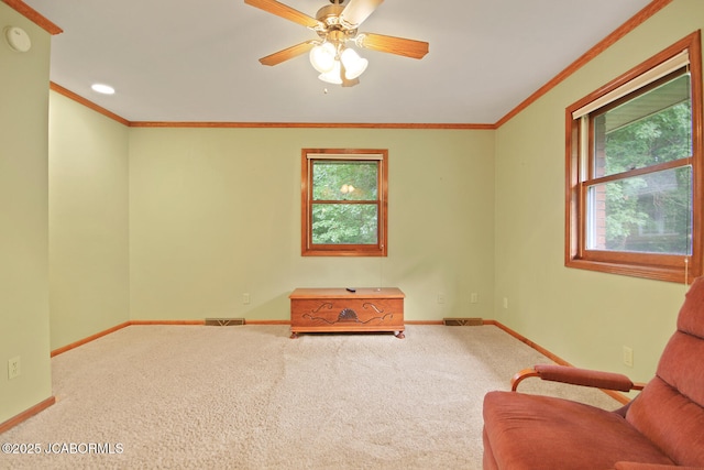 1101 E Maplewood Ct, Jefferson City, MO 65109 - sitting room featuring baseboards, carpet floors, a ceiling fan, and ornamental molding