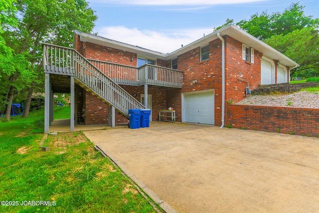 1101 E Maplewood Ct, Jefferson City, MO 65109 - rear view of property with a wooden deck, brick siding, and stairway