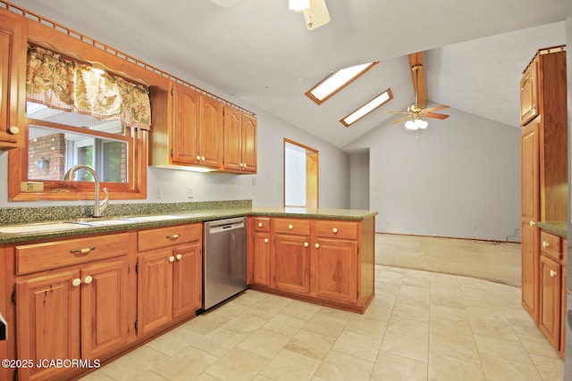 1101 E Maplewood Ct, Jefferson City, MO 65109 - kitchen featuring dishwasher, ceiling fan, a peninsula, a skylight, and light colored carpet