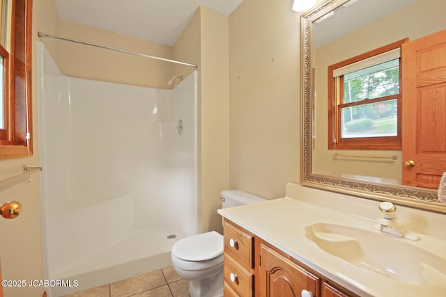 1101 E Maplewood Ct, Jefferson City, MO 65109 - full bath featuring toilet, vanity, tile patterned floors, and a shower