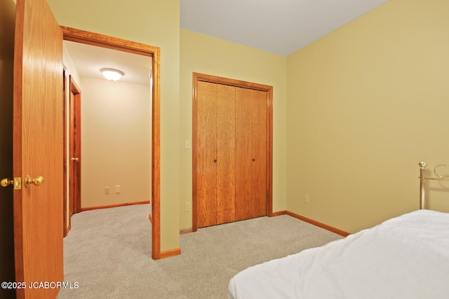1101 E Maplewood Ct, Jefferson City, MO 65109 - carpeted bedroom featuring a closet and baseboards