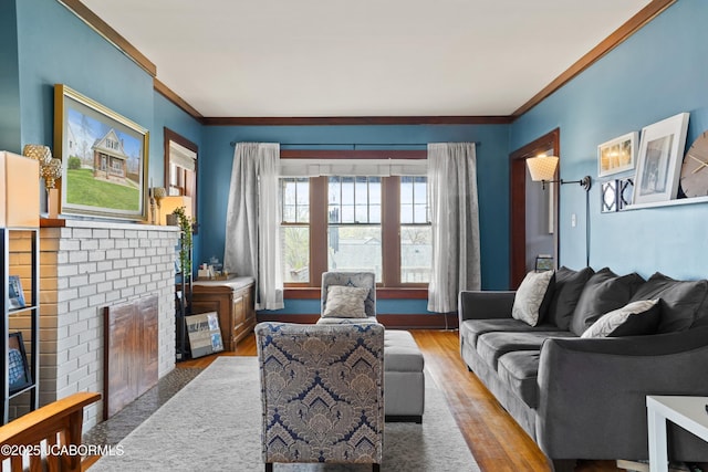 1400 W Main St, Jefferson City, MO 65101 - living area with ornamental molding, light wood-type flooring, and a brick fireplace